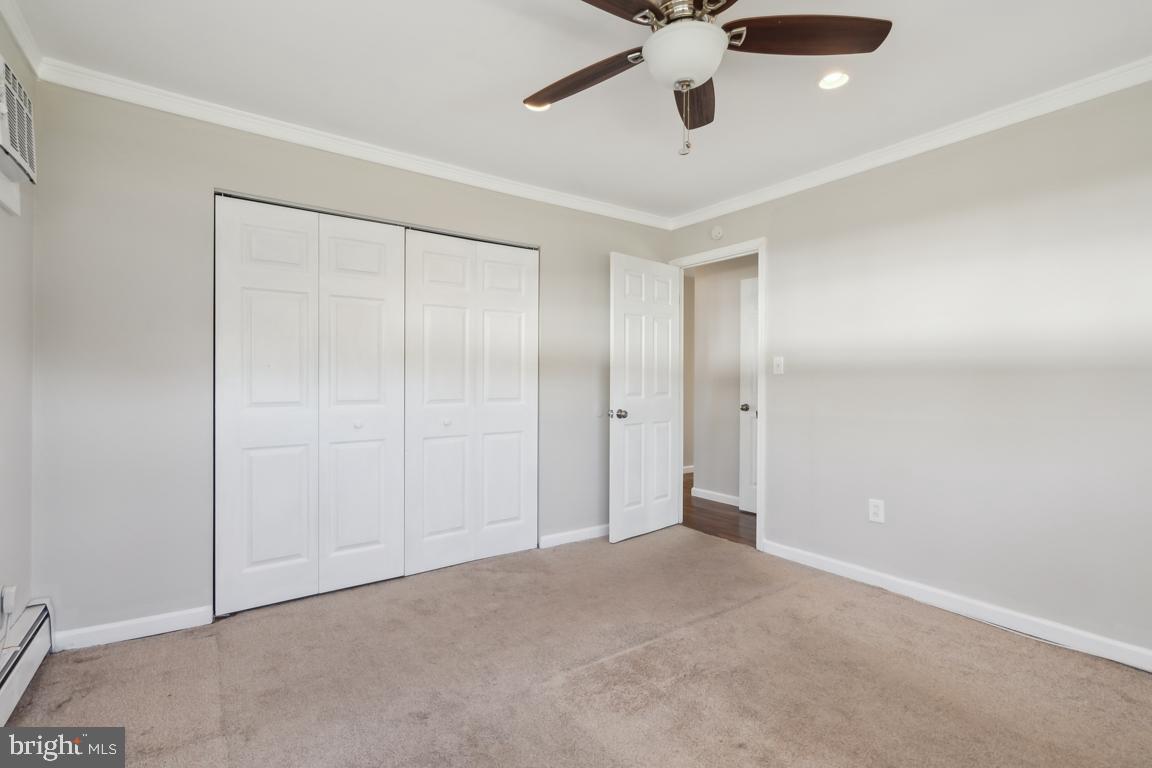 65 Gentle Road Levittown, PA 19057 - Photo 17 of 27 an empty room with a ceiling fan and carpet