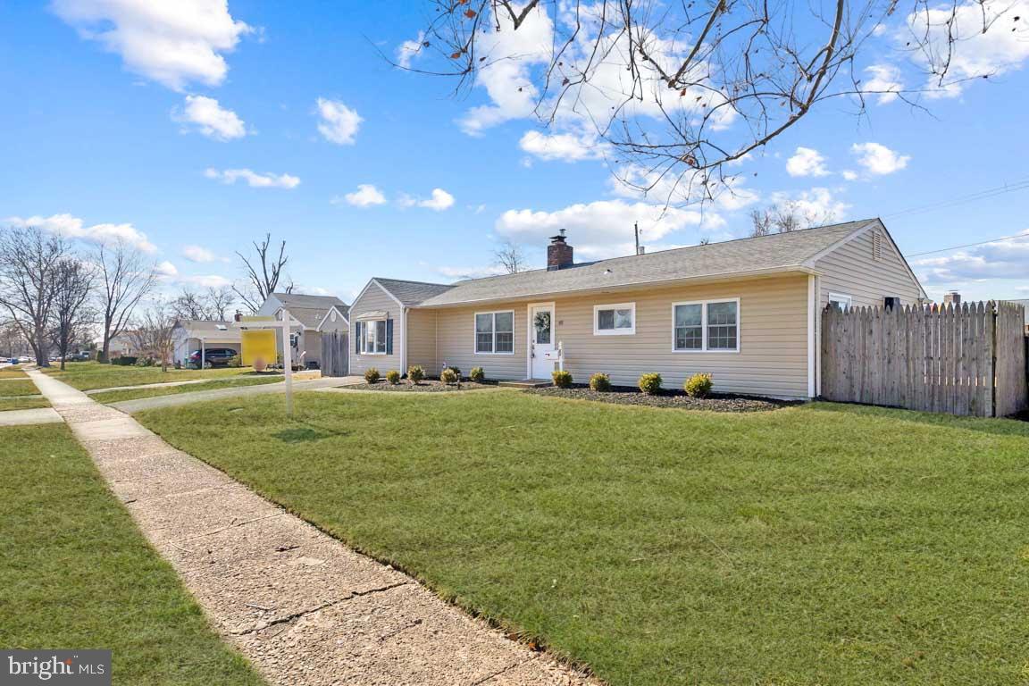 65 Gentle Road Levittown, PA 19057 - Photo 3 of 27 a view of a house with a big yard and a large tree