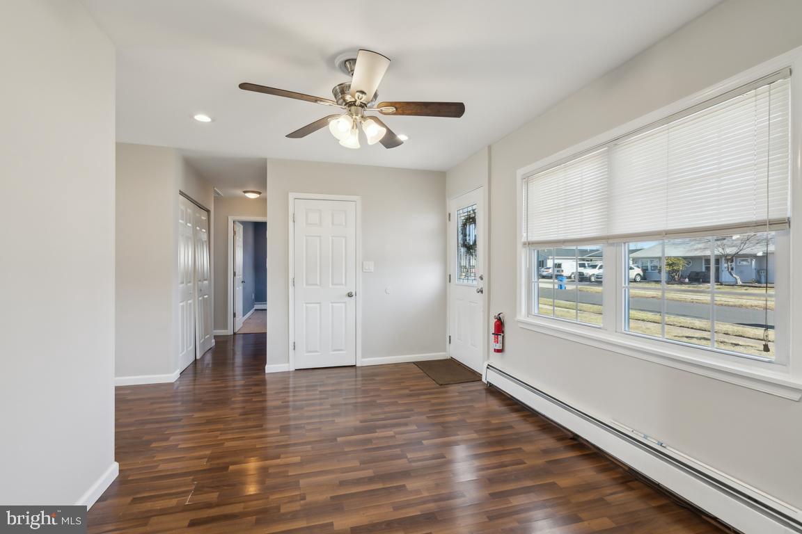 65 Gentle Road Levittown, PA 19057 - Photo 4 of 27 a view of an empty room with window and wooden floor