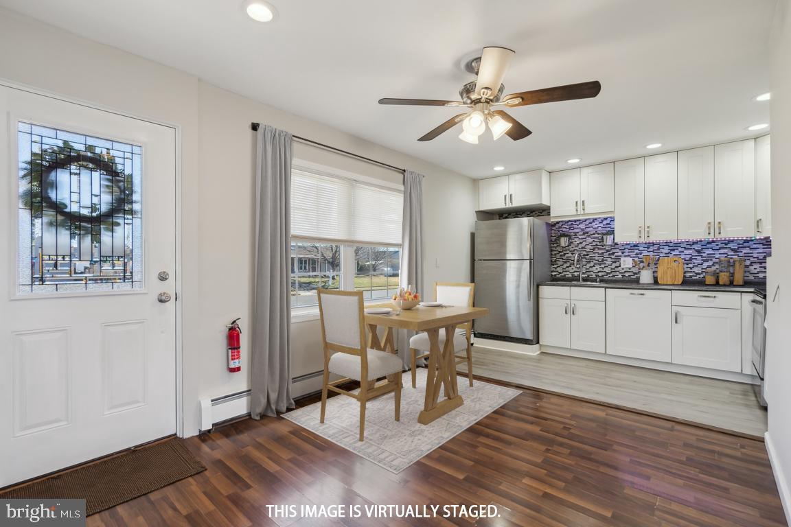 65 Gentle Road Levittown, PA 19057 - Photo 5 of 27 a view of a dining room with furniture window and wooden floor