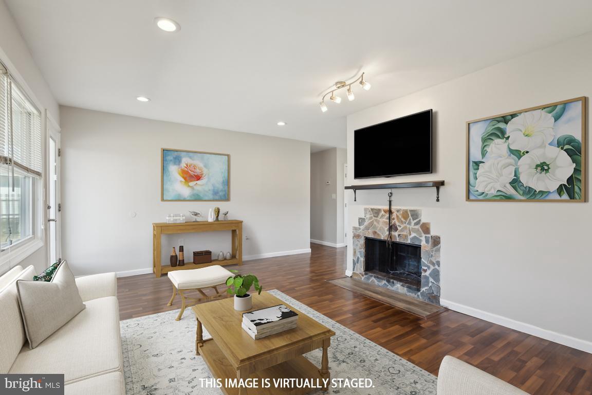 65 Gentle Road Levittown, PA 19057 - Photo 10 of 27 a living room with furniture and a flat screen tv