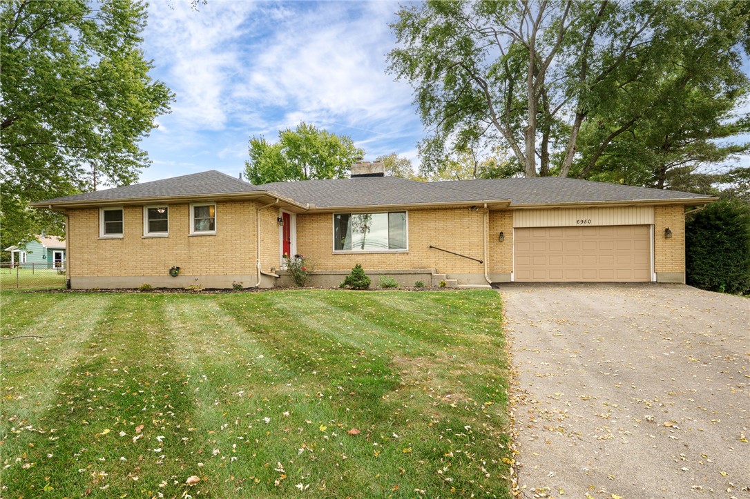 6950 Red Lion 5 Points Road Springboro, OH 45066 - Photo 2 of 78 This charming home offers a spacious lawn and convenient attached garage.