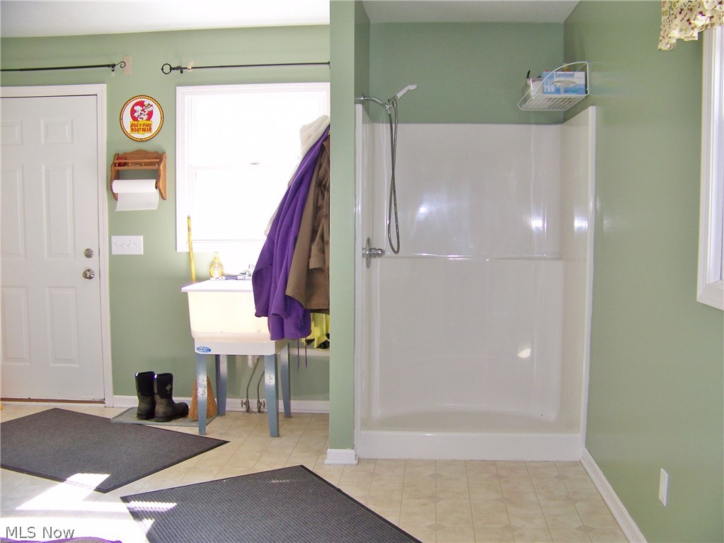 3000 Granger Road Medina, OH 44256 - Photo 14 of 19 Mud room/utility room - utility sink, shower, dutch-door to great room, access to back yard, basement and garage.