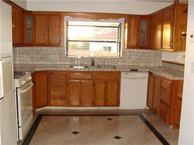 543 Rimrock Road El Cajon, CA 92020 - Photo 9 of 13 All Custom cabinetry through out the kitchen and Dining Room. Marble floors. This is one side. see the other next