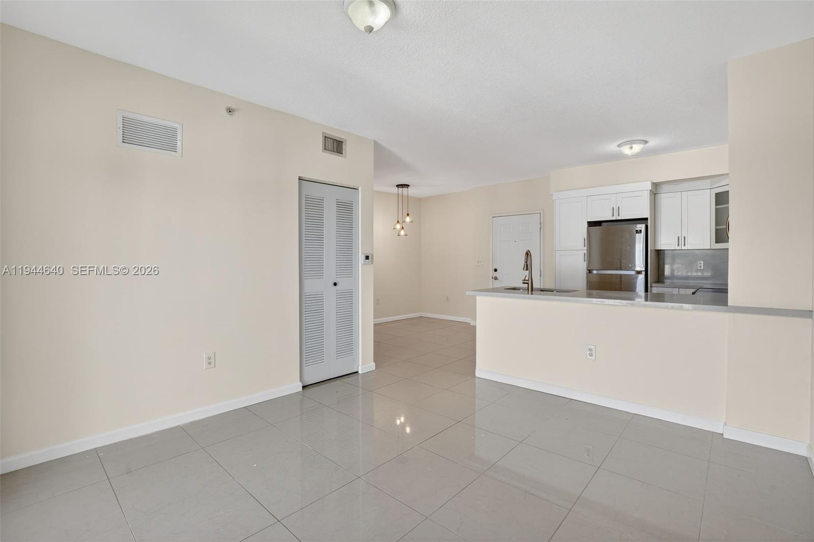 11060 Southwest 196th Street, Unit 605 Cutler Bay, FL 33157 - Photo 13 of 26 a view of a kitchen with white cabinets