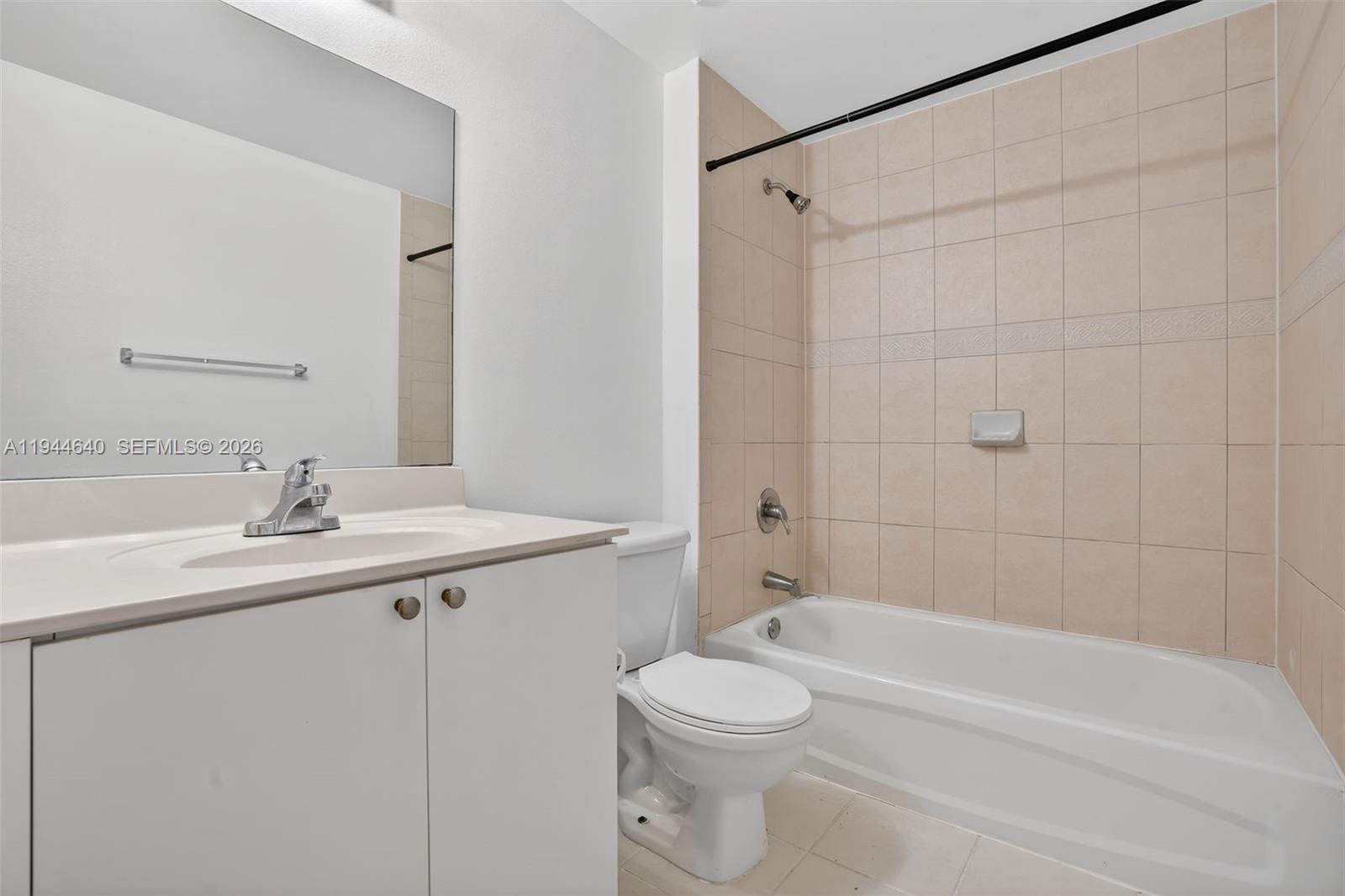 11060 Southwest 196th Street, Unit 605 Cutler Bay, FL 33157 - Photo 14 of 26 a bathroom with a sink a toilet and shower