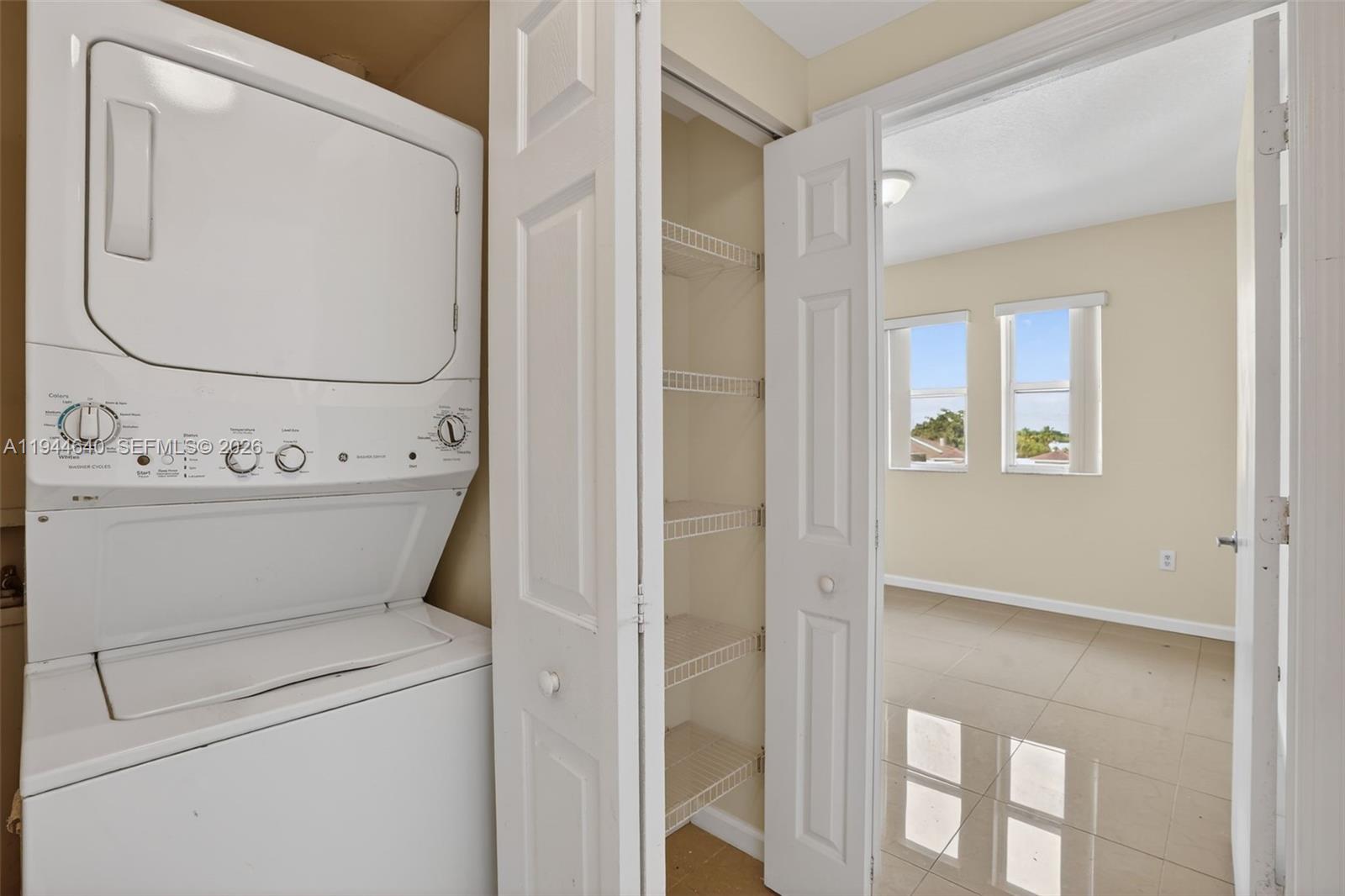 11060 Southwest 196th Street, Unit 605 Cutler Bay, FL 33157 - Photo 20 of 26 a utility room with dryer and washer