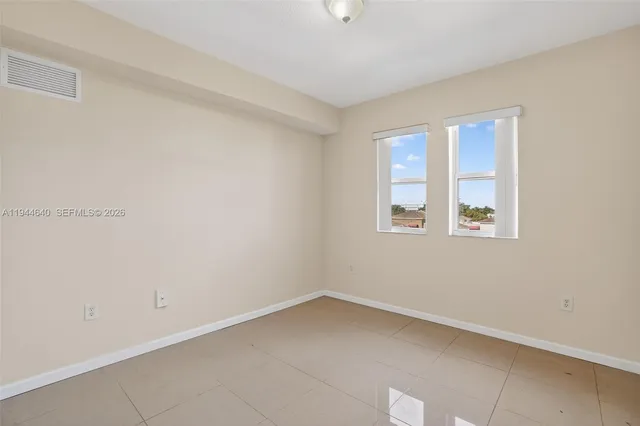 a bedroom with bed and window