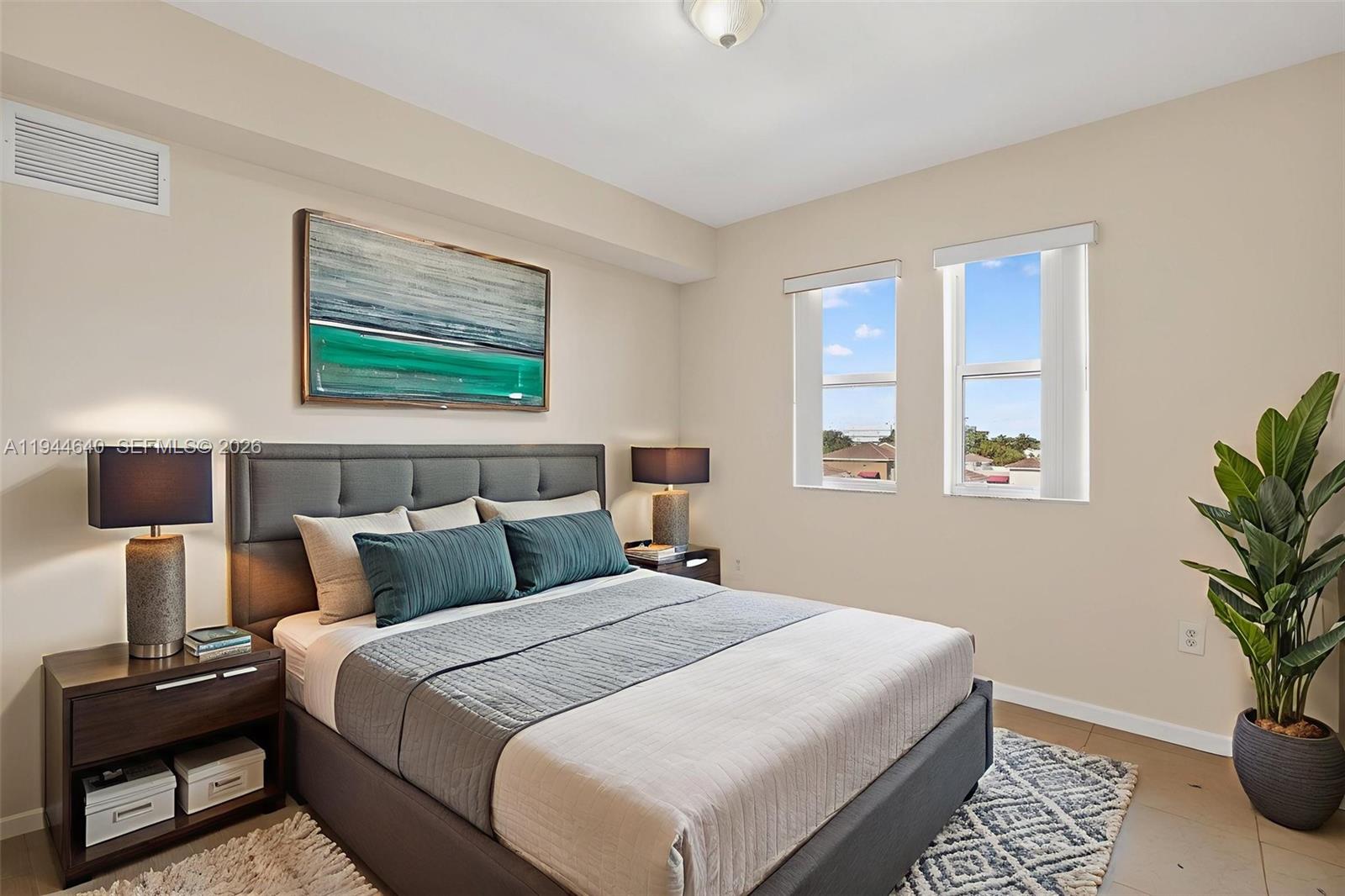 11060 Southwest 196th Street, Unit 605 Cutler Bay, FL 33157 - Photo 22 of 26 a bedroom with bed and window