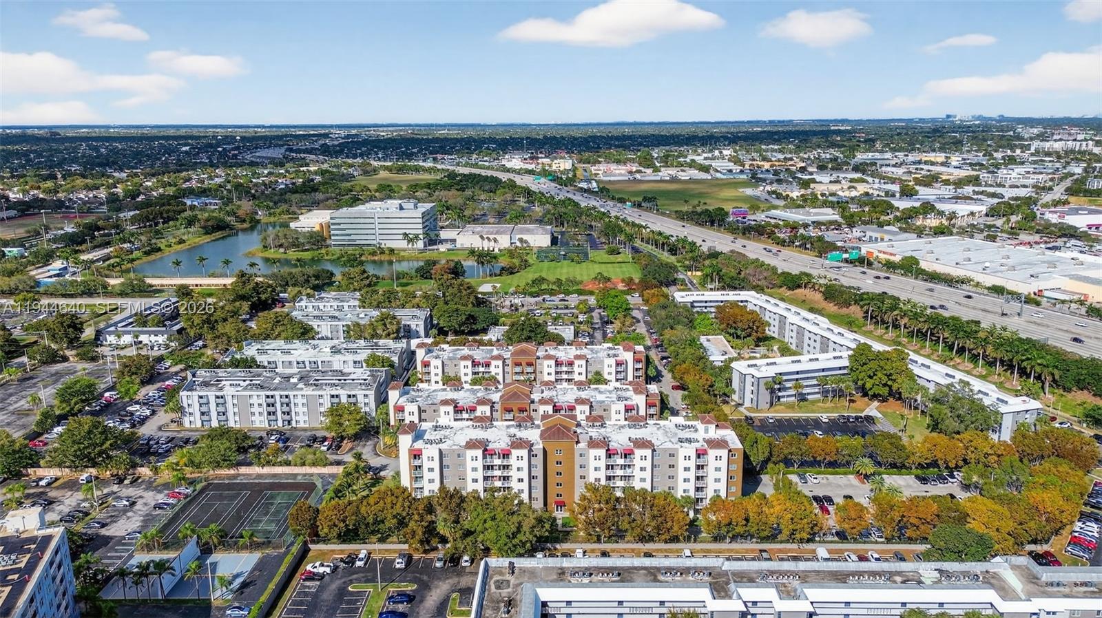 11060 Southwest 196th Street, Unit 605 Cutler Bay, FL 33157 - Photo 5 of 26 an aerial view of residential building with parking