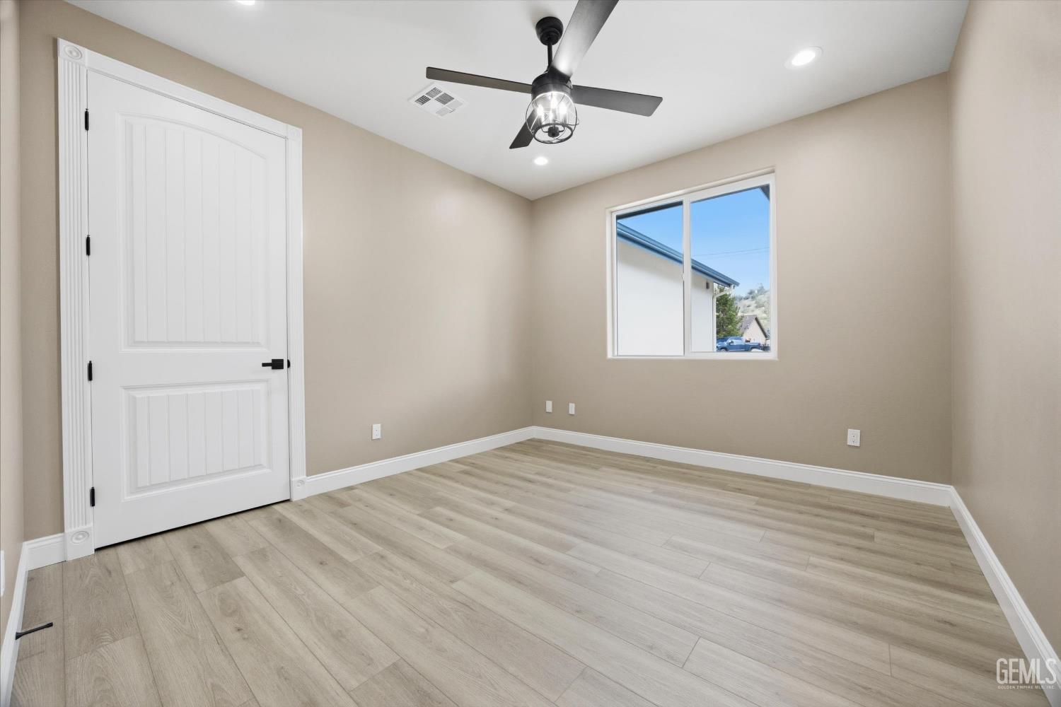 Undisclosed Address Tehachapi, CA 93561 - Photo 39 of 47 wooden floor in an empty room with a window