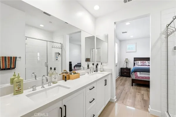 a bedroom with a bed and a couch