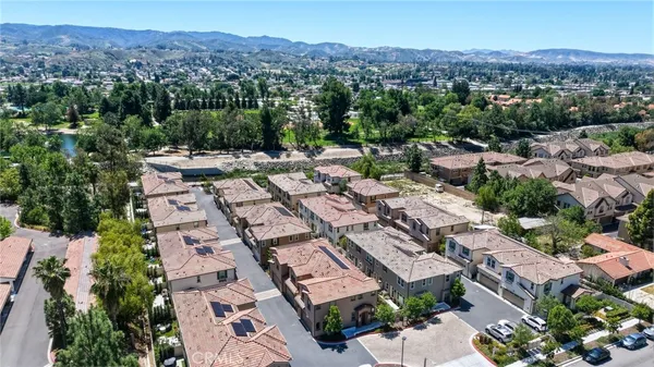 an aerial view of residential house with outdoor space and mountain view