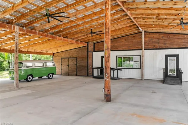 a view of a patio with wooden floor and outdoor seating