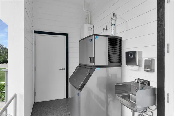 a kitchen with stainless steel appliances a sink stove and refrigerator