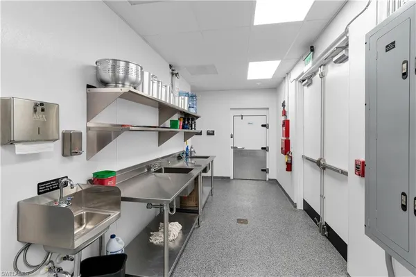 a view of a hallway with washer and dryer