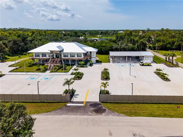 an aerial view of a house with swimming pool garden and outdoor seating
