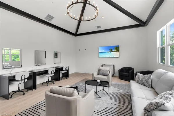 a living room with furniture a rug and a window