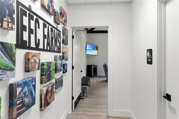 a view of an entryway with wooden floor