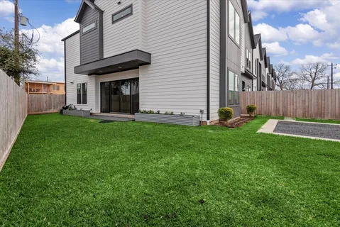 a view of a backyard of the house