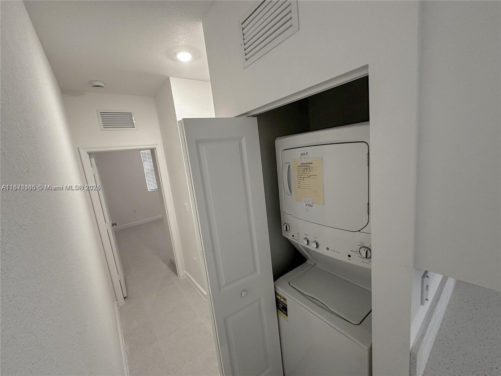 14804 Southwest 162nd Street Miami, FL 33177 - Photo 3 of 6 a utility room with dryer and washer