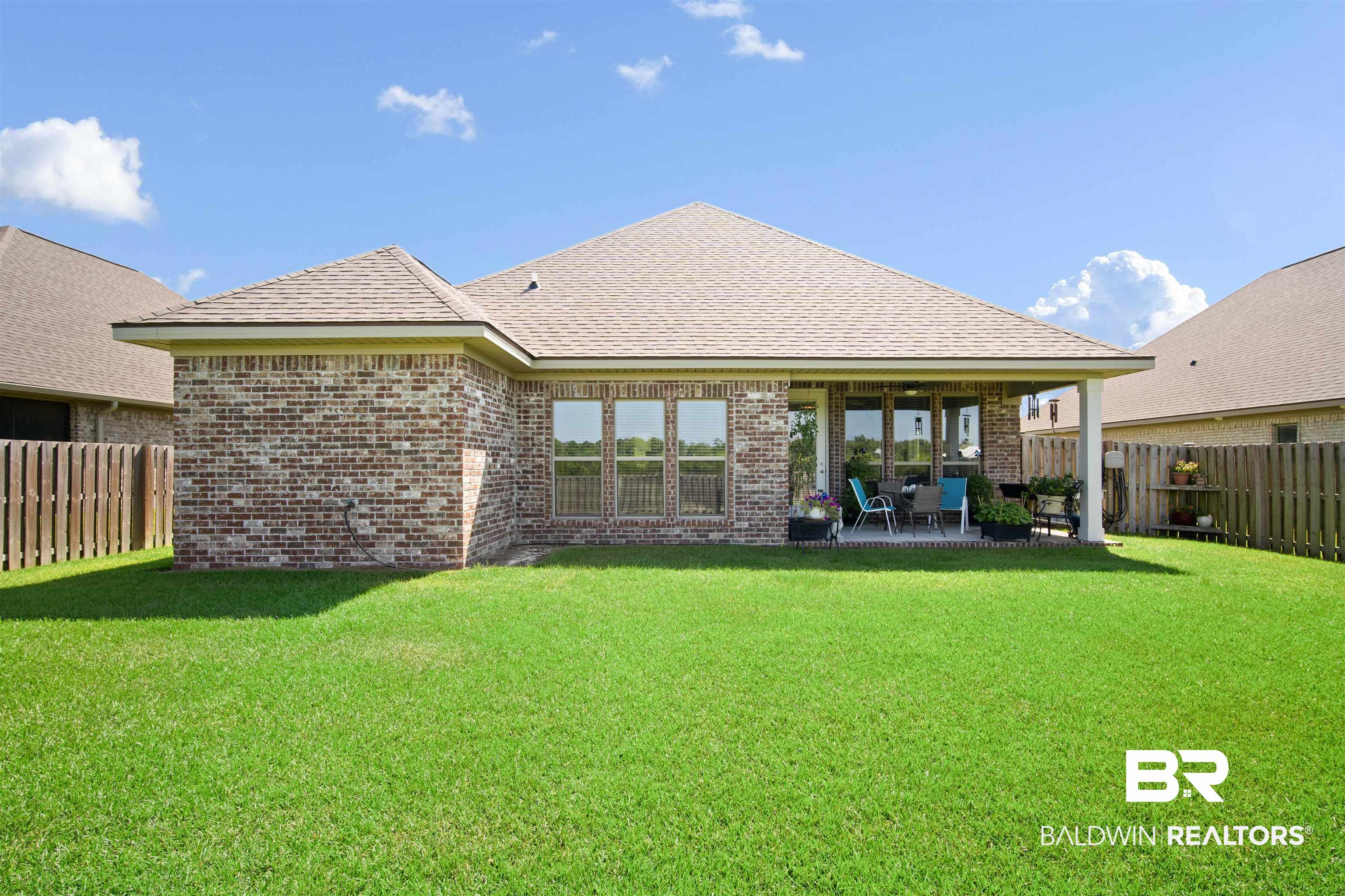 969 Charleston Loop Fairhope, AL 36532 - Photo 29 of 30 Rear view of property featuring a patio area and a yard