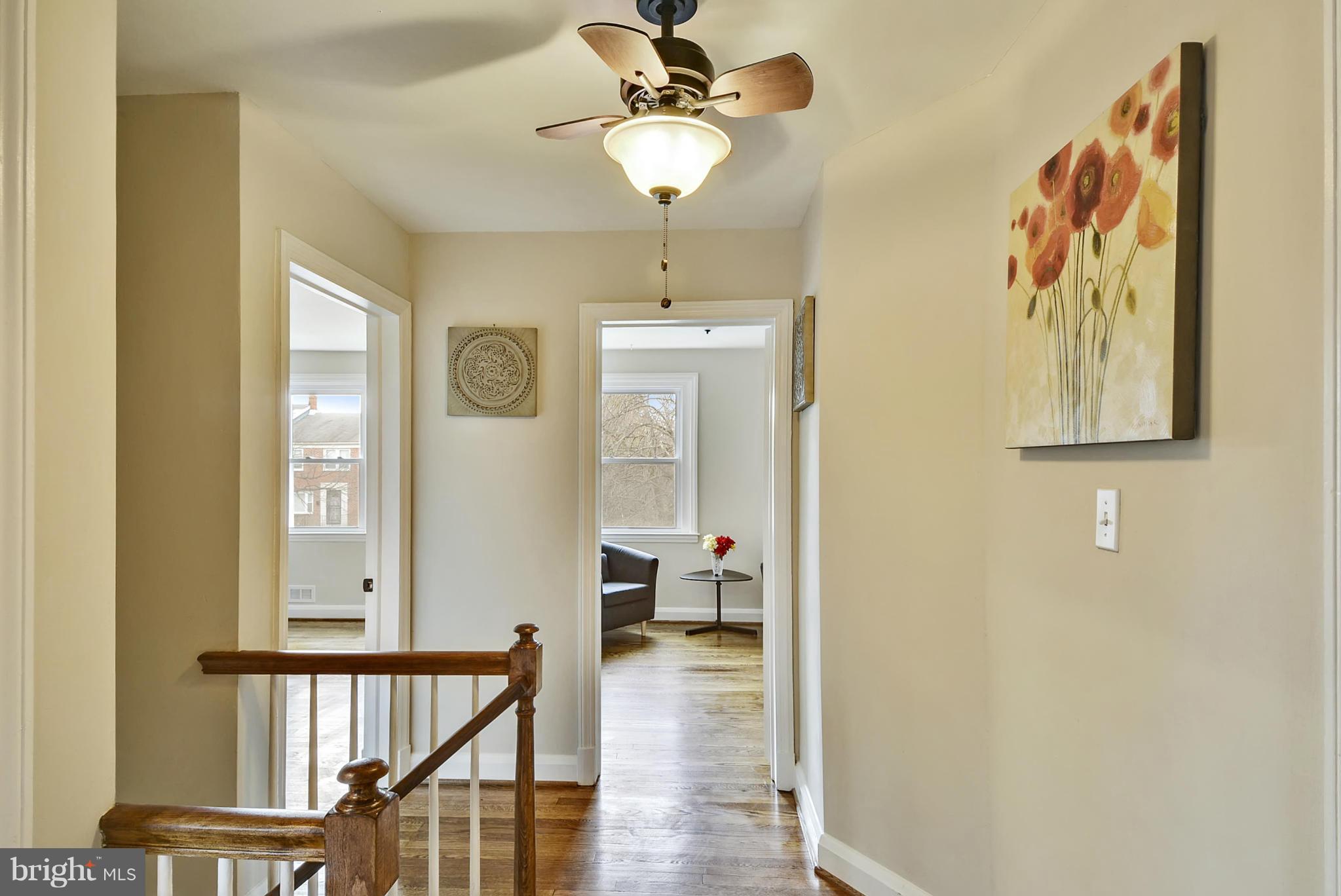 1602 Heathfield Road Baltimore, MD 21239 - Photo 11 of 27 a view of a hallway with wooden floor and staircase