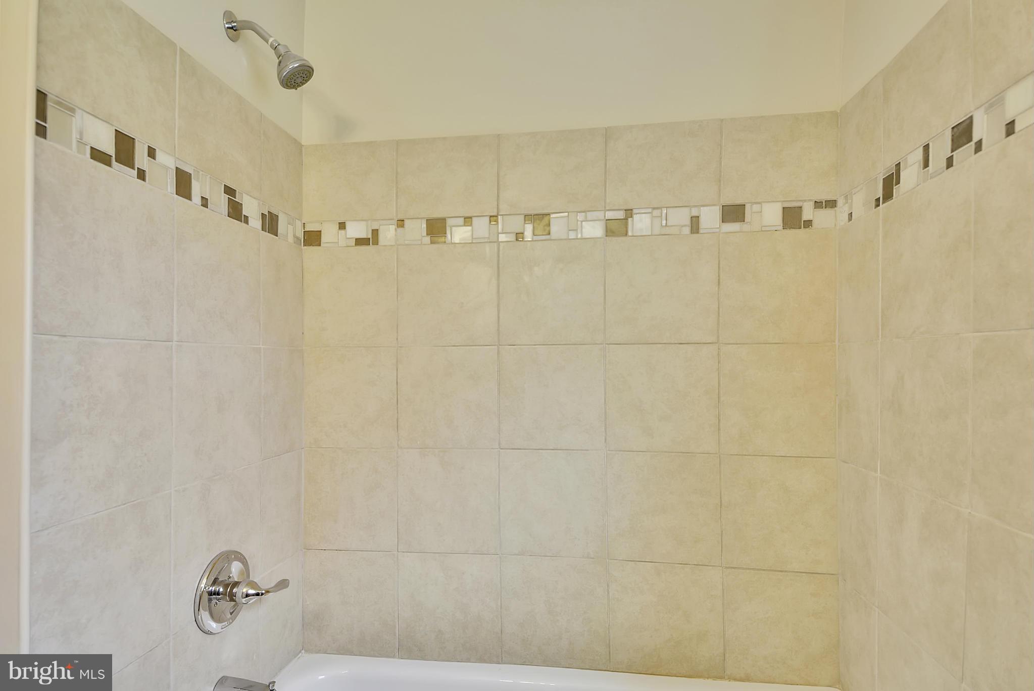 1602 Heathfield Road Baltimore, MD 21239 - Photo 13 of 27 a bathroom with a shower