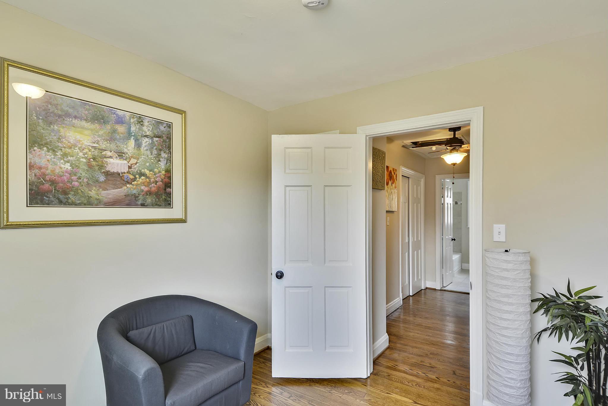 1602 Heathfield Road Baltimore, MD 21239 - Photo 17 of 27 a view of a livingroom with furniture and wooden floor