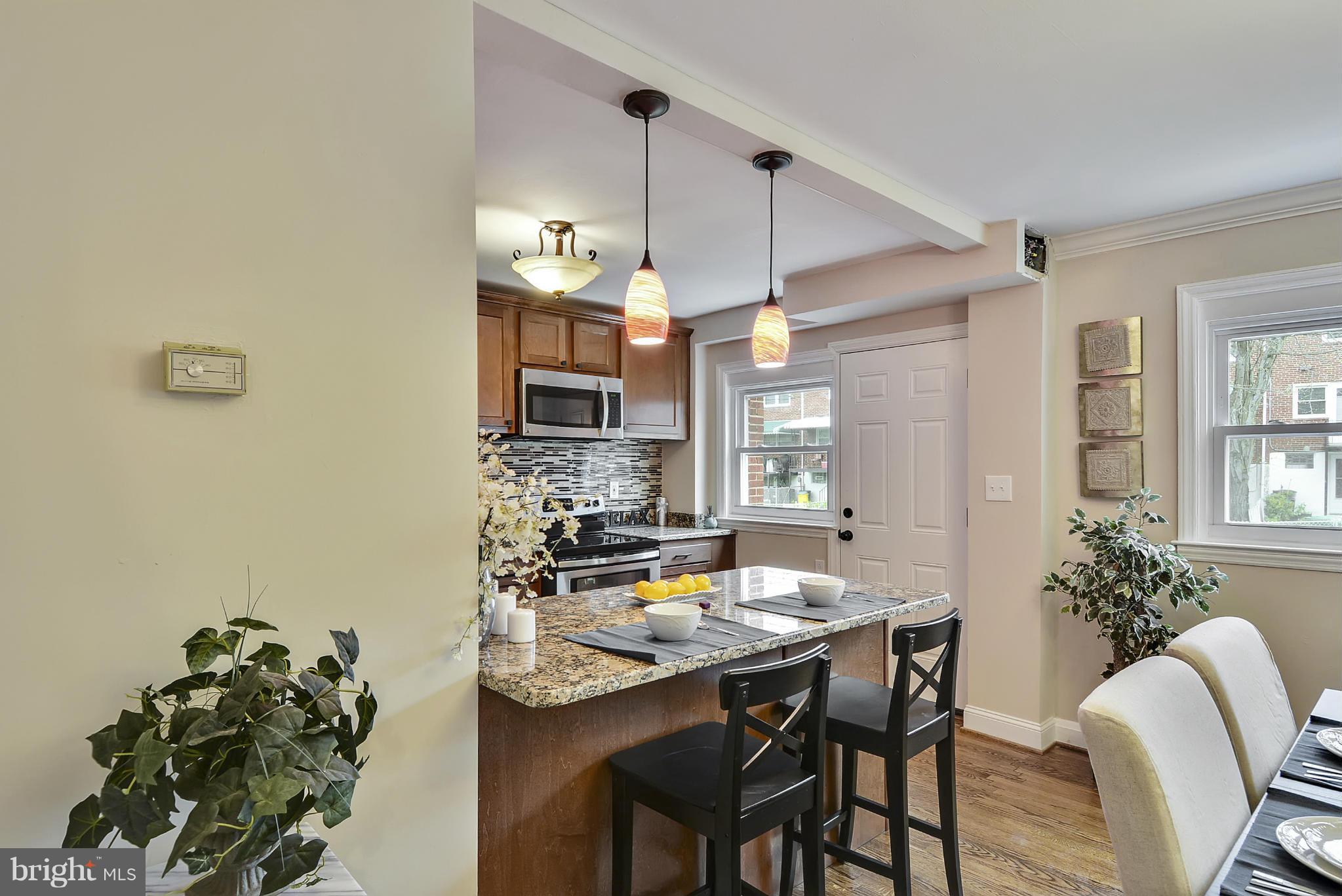 1602 Heathfield Road Baltimore, MD 21239 - Photo 3 of 27 a view of a dining room with furniture and chandelier