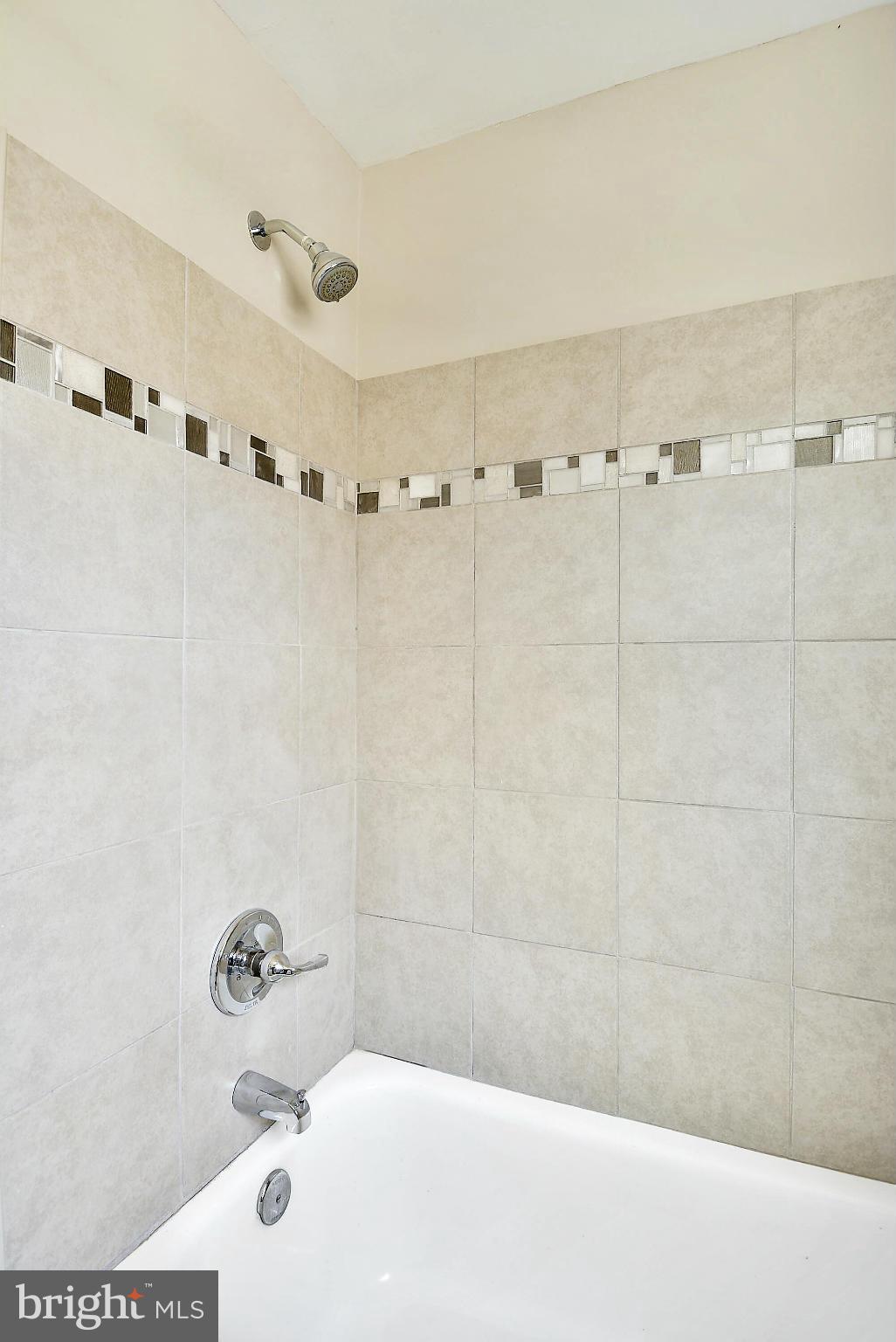 1602 Heathfield Road Baltimore, MD 21239 - Photo 21 of 27 a bathroom with a bathtub and shower