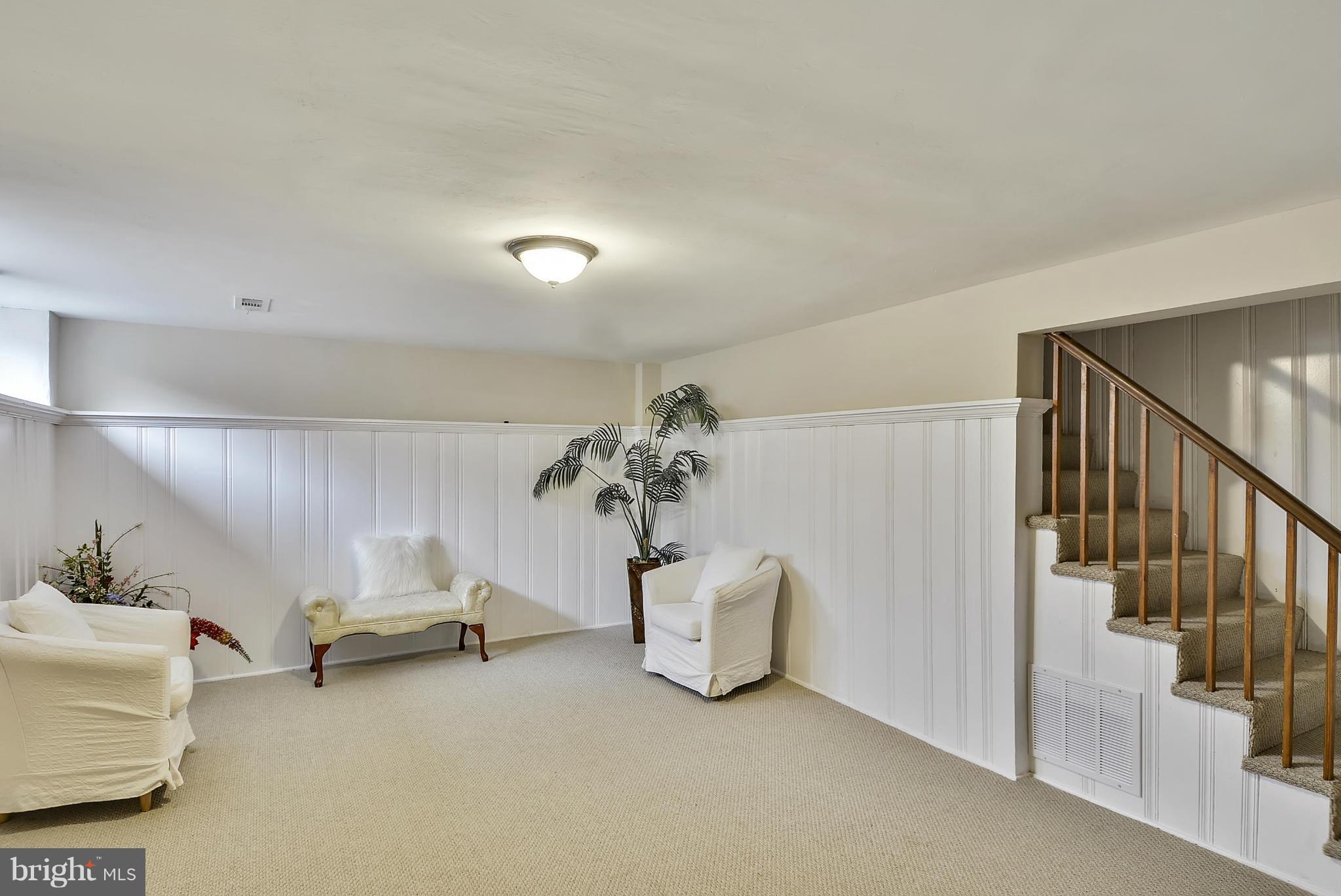 1602 Heathfield Road Baltimore, MD 21239 - Photo 23 of 27 a view of livingroom with furniture and stairs