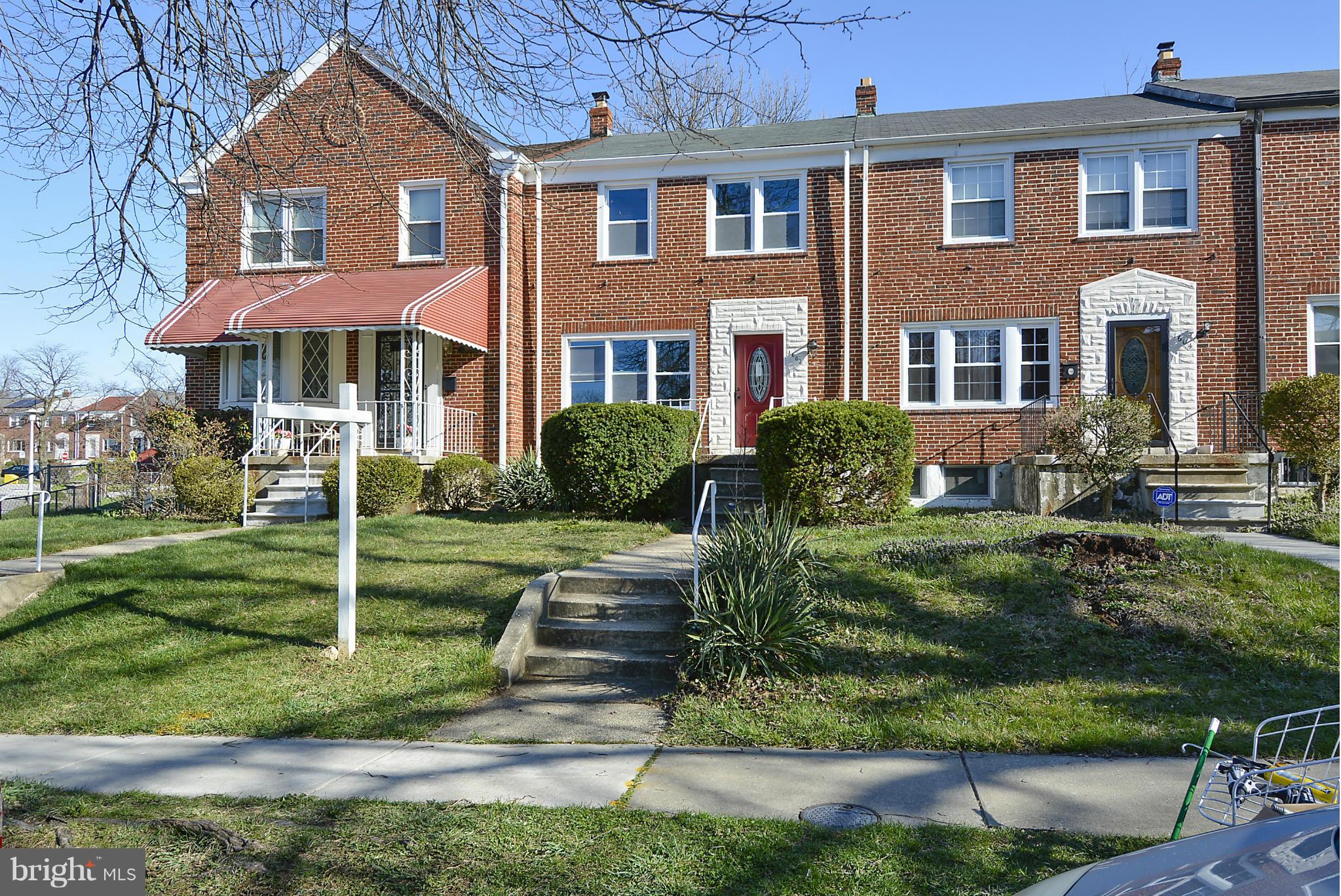 1602 Heathfield Road Baltimore, MD 21239 - Photo 24 of 27 a front view of a house with a yard