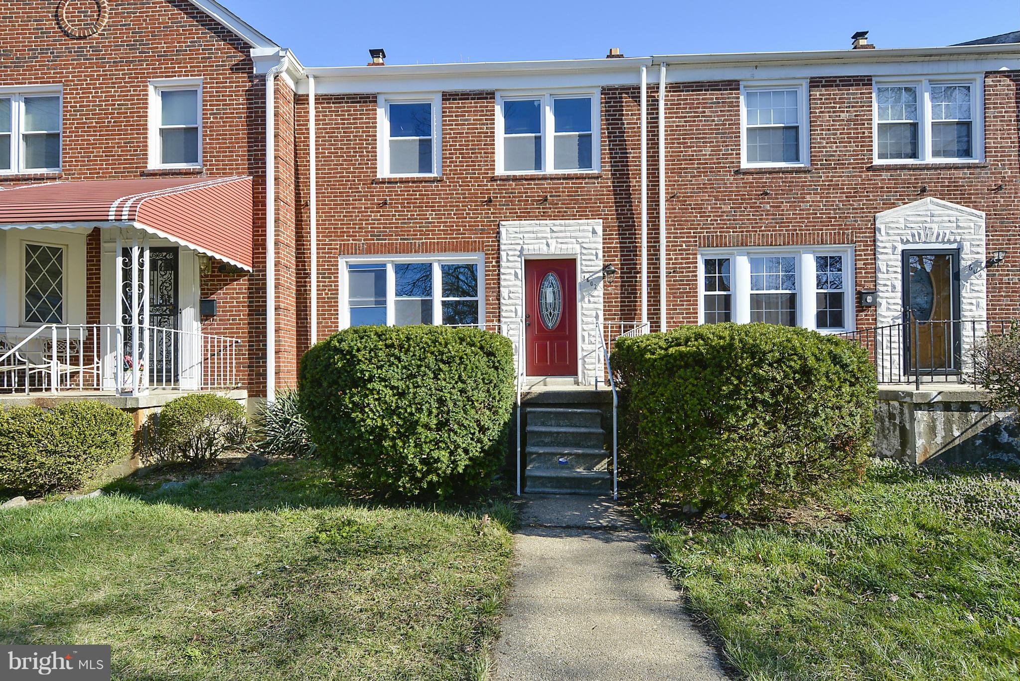 1602 Heathfield Road Baltimore, MD 21239 - Photo 25 of 27 a view of a brick house with a yard and plants