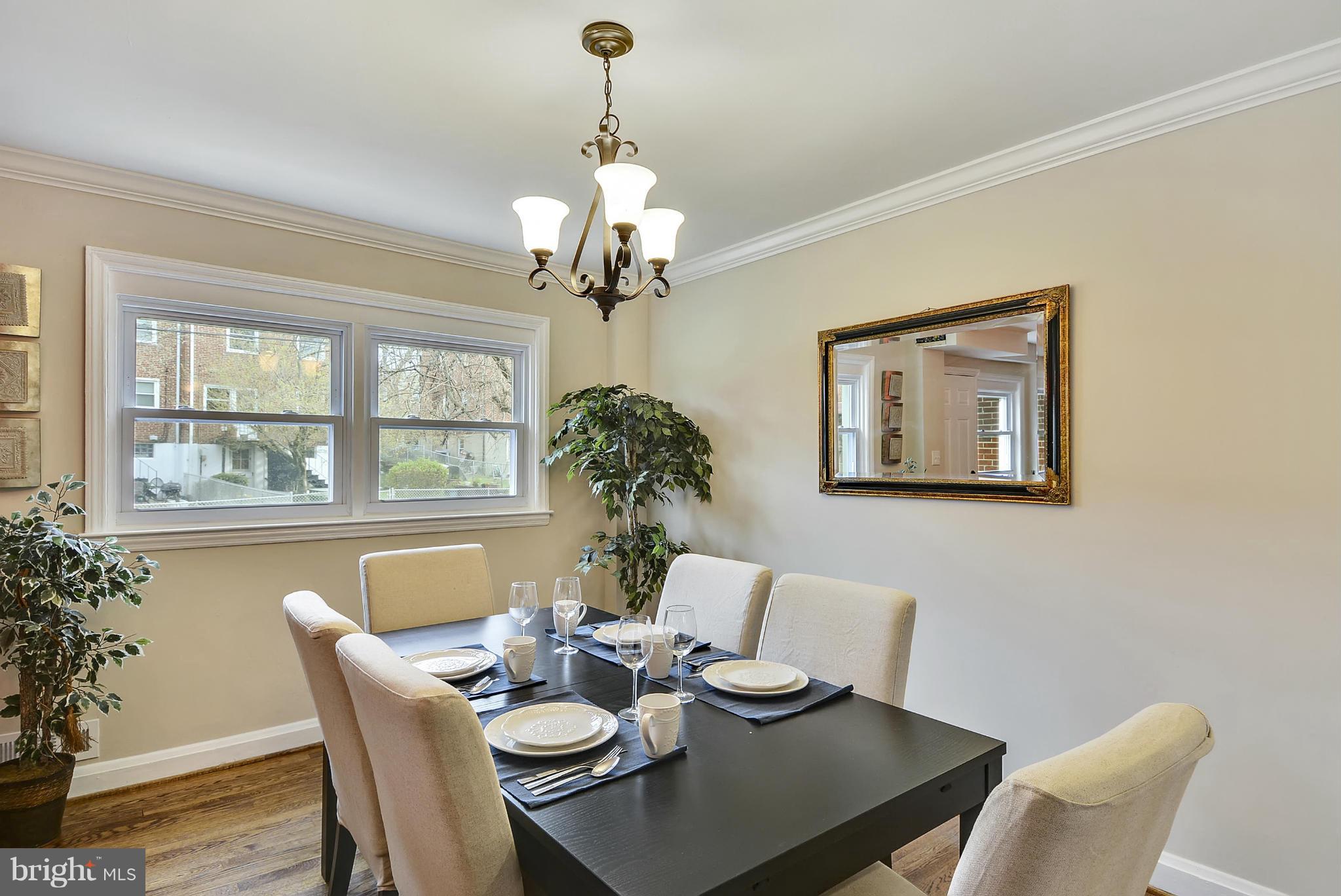 1602 Heathfield Road Baltimore, MD 21239 - Photo 4 of 27 a view of a dining room with furniture window and wooden floor