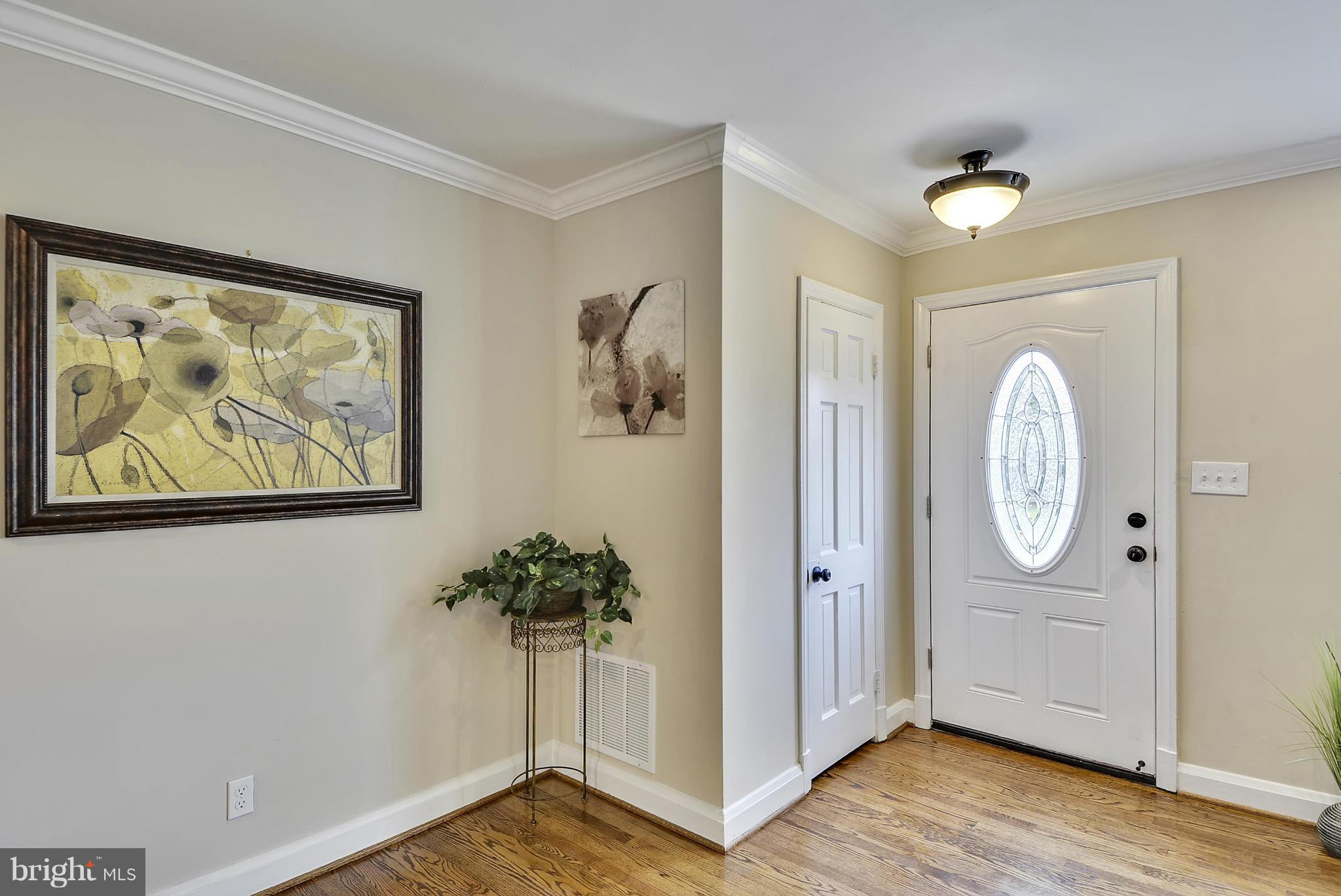 1602 Heathfield Road Baltimore, MD 21239 - Photo 5 of 27 a view of a hallway with painted walls