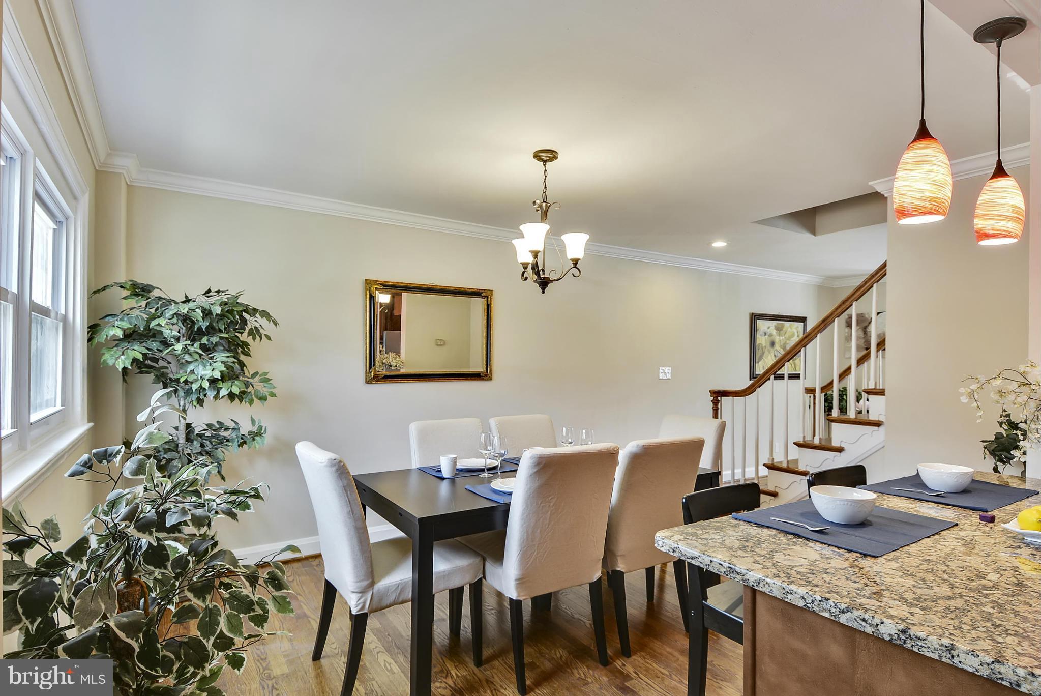 1602 Heathfield Road Baltimore, MD 21239 - Photo 6 of 27 a view of a dining room with furniture and a chandelier