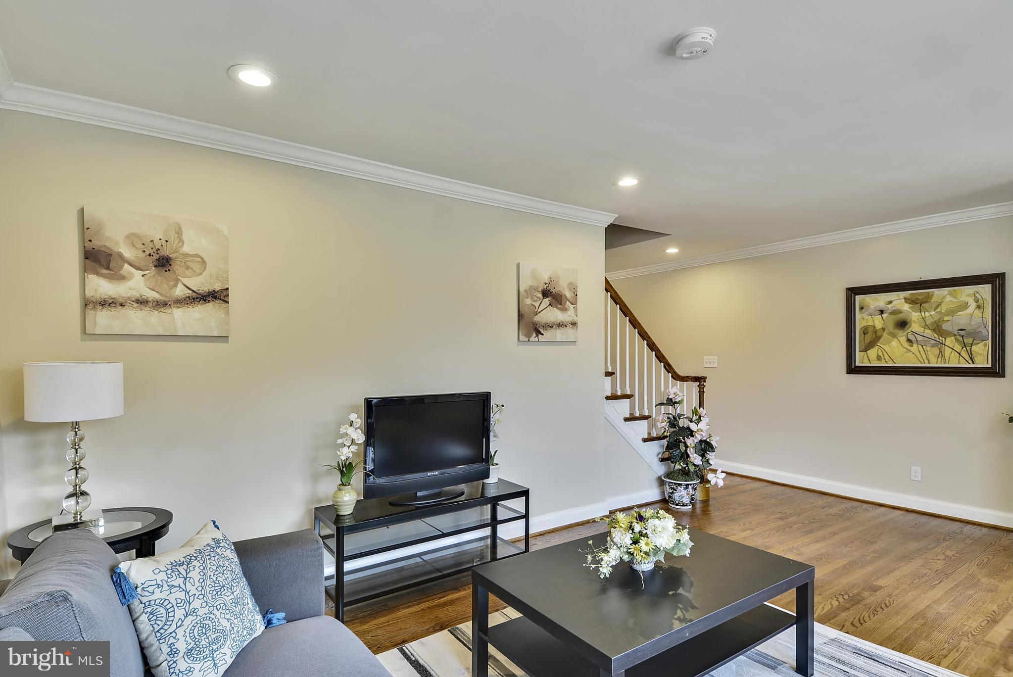 1602 Heathfield Road Baltimore, MD 21239 - Photo 8 of 27 a living room with furniture and a flat screen tv