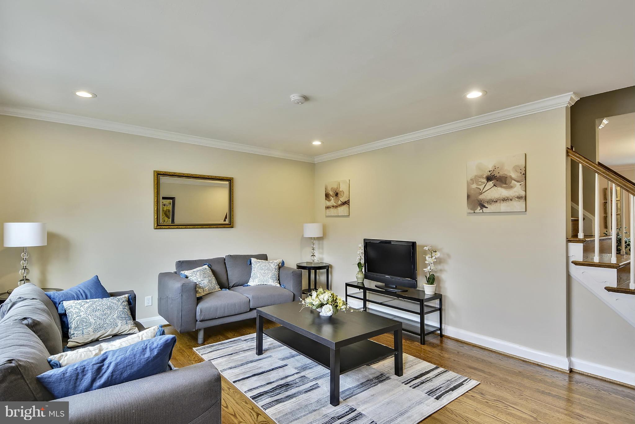 1602 Heathfield Road Baltimore, MD 21239 - Photo 9 of 27 a living room with furniture and a flat screen tv