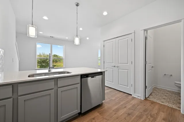 a kitchen with a sink and window