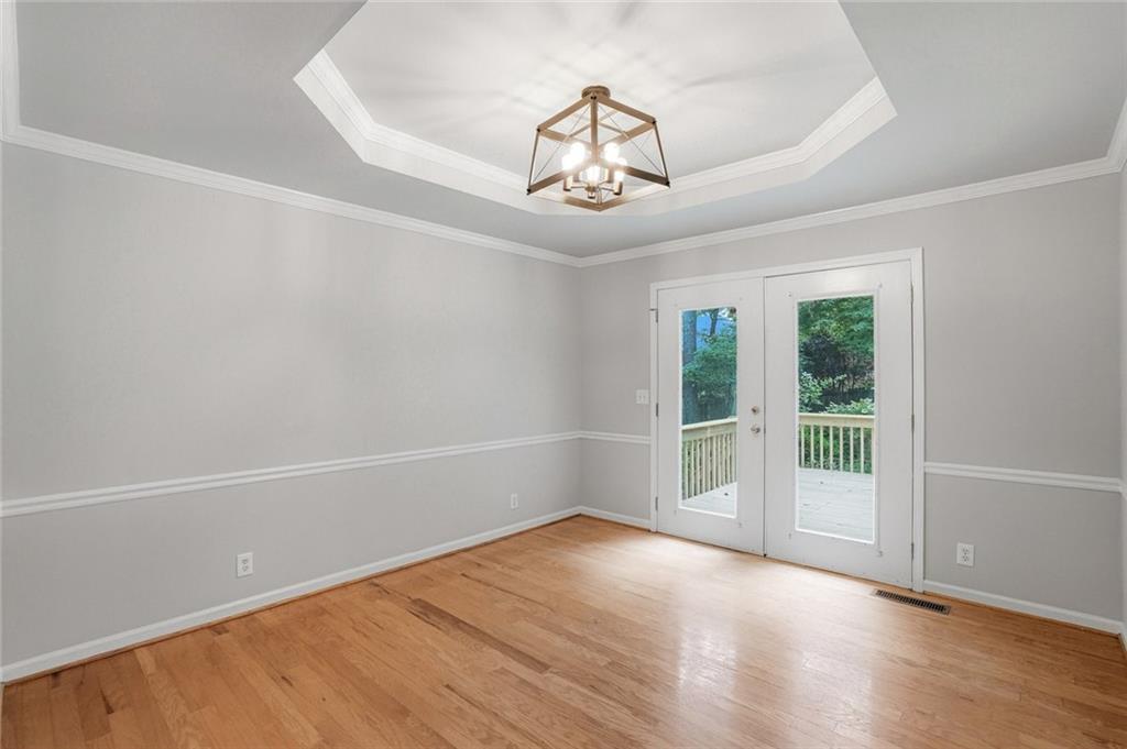 13 Bedford Ridge Northwest Cartersville, GA 30121 - Photo 11 of 19 an empty room with wooden floor fan and windows