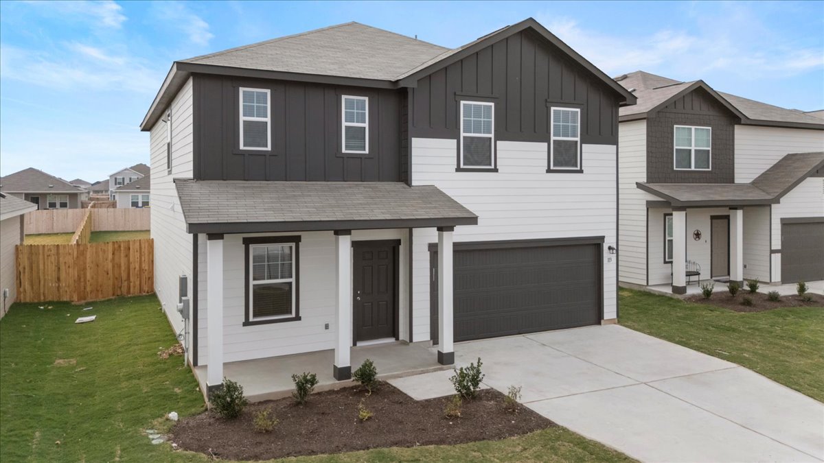 113 Rother Place Taylor, TX 76574 - Photo 3 of 34 View of front facade with board and batten siding, covered porch, concrete driveway, a shingled roof, and a garage