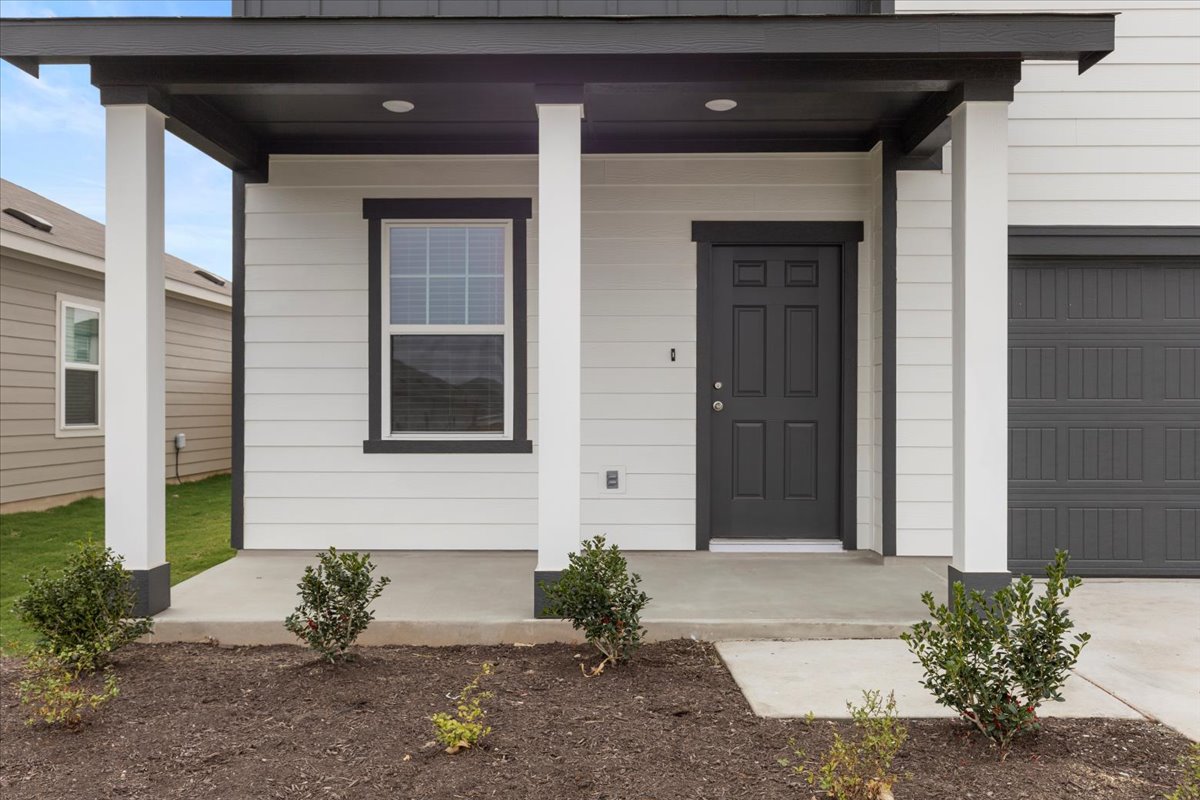 113 Rother Place Taylor, TX 76574 - Photo 5 of 34 Doorway to property with a porch and a garage