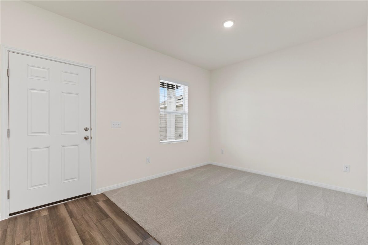 113 Rother Place Taylor, TX 76574 - Photo 6 of 34 Foyer entrance featuring wood finished floors and recessed lighting