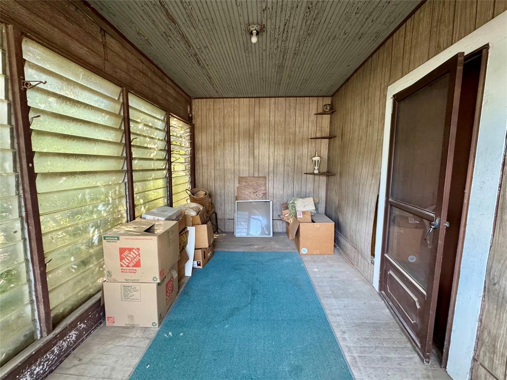 807 North Marable Street West, TX 76691 - Photo 19 of 27 a bathroom with a sink a large mirror and shower