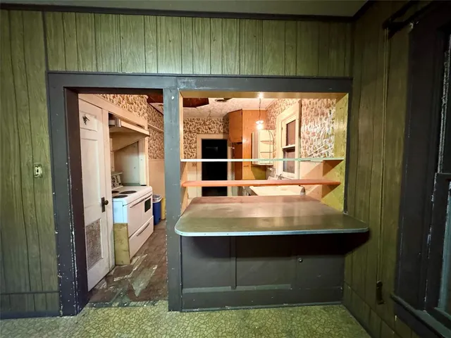 a room with washing machine and tub