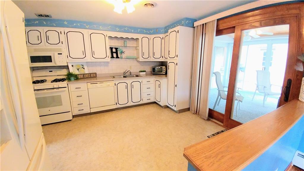 148 Morgan Hill Road Cuddy, PA 15031 - Photo 11 of 25 Yes, there is space for that small kitchen table, or better yet-add an island adding countertop space, or expand the peninsula making additional bar seating & workspace!