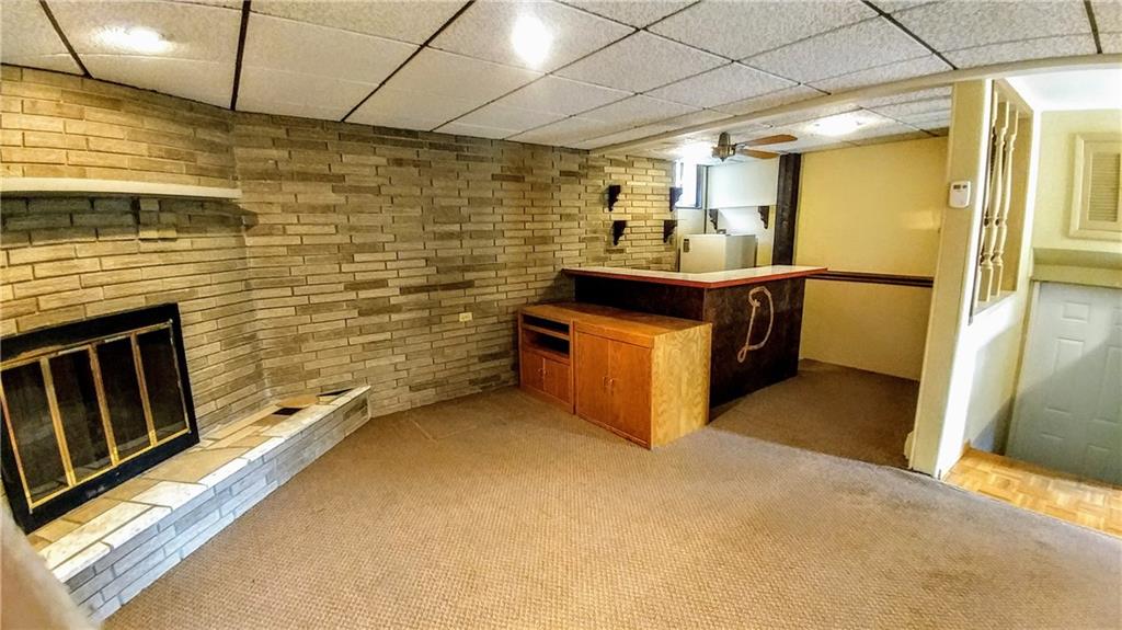 148 Morgan Hill Road Cuddy, PA 15031 - Photo 21 of 25 Complete with refrigerator and sink, this wet bar is ready for guests to partake in some light hearted shenanigans and just enjoy life after a hard week at work.