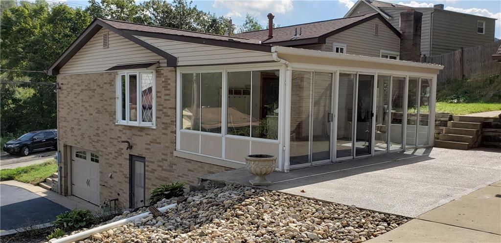 148 Morgan Hill Road Cuddy, PA 15031 - Photo 22 of 25 Look at this gorgeous sunroom! Imagine yourself drinking your morning coffee while beginning the day in this room. Lovely! Add a porch swing on your patio and bask in the warm sunlight.
