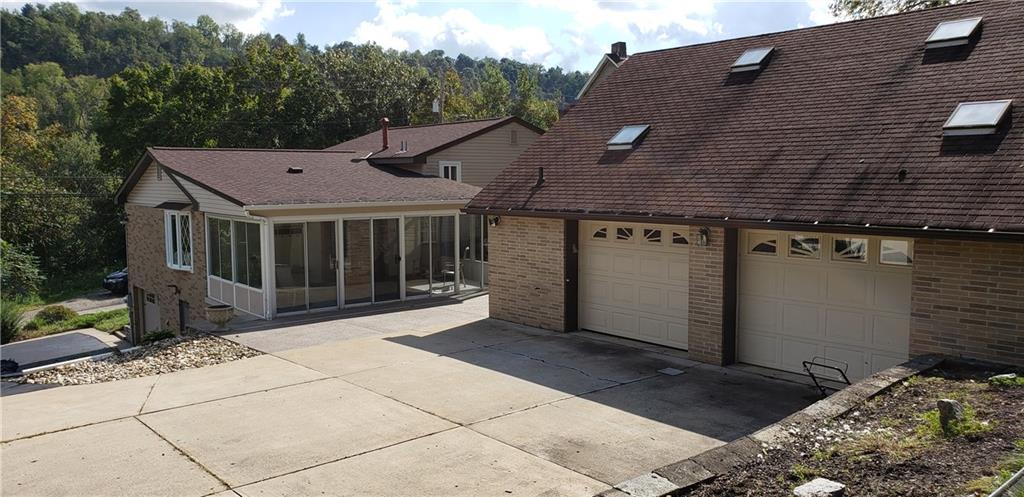 148 Morgan Hill Road Cuddy, PA 15031 - Photo 24 of 25 Check out this garage, about 32'X33' and this thing was built solid! Don't forget to take a peek at the storage upstairs and the powder room. What a garage!
